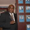 Jamaica's Mike McCallum poses by his plaque on the Hall of Fame Wall