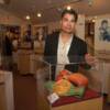 Carlos Palomino poses by his display of championship memorabilia in Hall of Fame