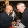 Angelo Dundee enjoys time with a boxing fan