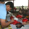 Erik (El Terrible) Morales signs autographs for his fans