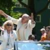 Carlos Ortiz embraces the excitement of the parade as his wife and grandson look on