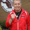 Middleweight champion Vito Anutofermo raises a fist by the HOF logo