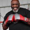 Hall of Famer Dwight Qawi in the ring filming a segment for the TV show "In This Corner."