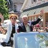 2017 inductee Barry Tompkins and his wife Joan acknowledge parade crowd.