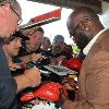 Fan favorite James "Lights Out" Toney signs autographs.