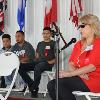 Johnny Tapia's sons listening to Teresa Tapia share stories about their father with fans at ringside lecture.