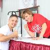 Fan favorite Christy Martin poses with a fan following her ringside lecture.