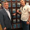 Teddy Atlas and his fighter, WBC light heavyweight champion Oleksandr Gvozdky pose by Atlas' HOF plaque