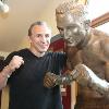 "Boom Boom" poses by the life-size statue of Canastota's Carmen Basilio