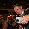 "Triple G" takes a selfie with a fan at the Banquet of Champions